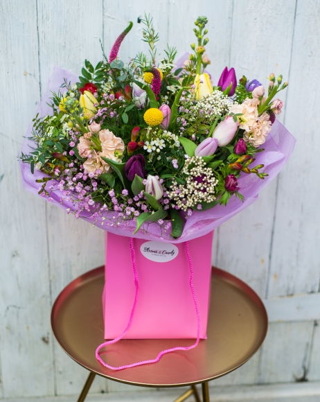 Spring fresh flowers bouquet to include stocks, tulips, crasledia, wax, roses and seasonal foliage and fillers. Bouquet made by florist in Bro, Kent