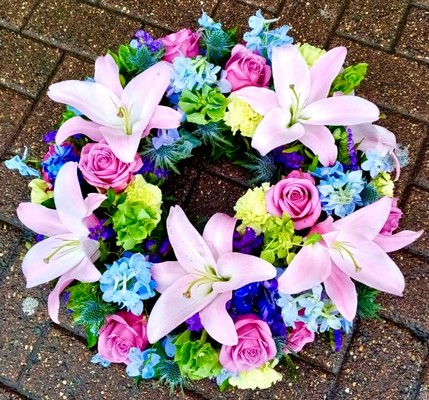 lilies and roses funeral wreath