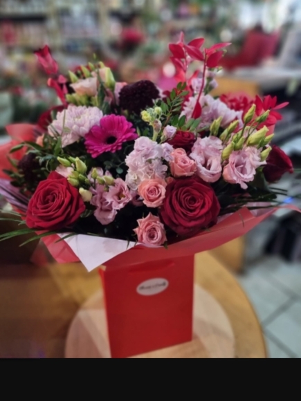 Bespoke made bouquet with reds and pinks, scented.