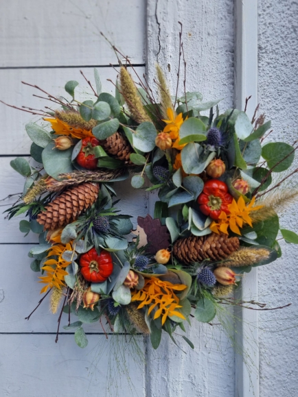 Fresh bespoke made autumn wreath made by Blooms and Candy Florist