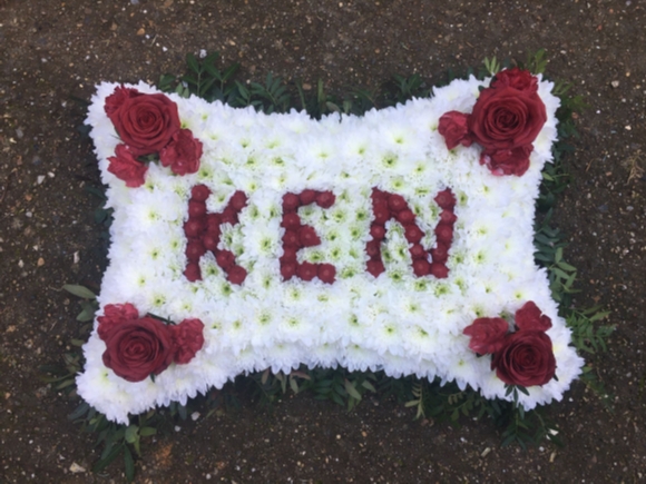 Based large pillow with letters made of flowers. By Blooms and Candy Florist from Bromley