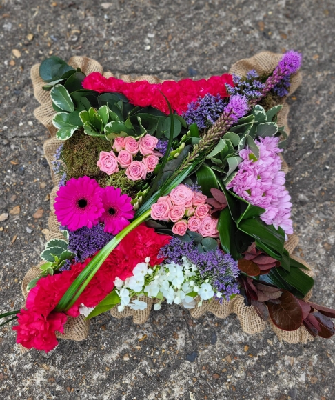 Amazing avant-garde design with tropical flowers and unusual foliage. Colours can be personalised. By florist in Bromley
