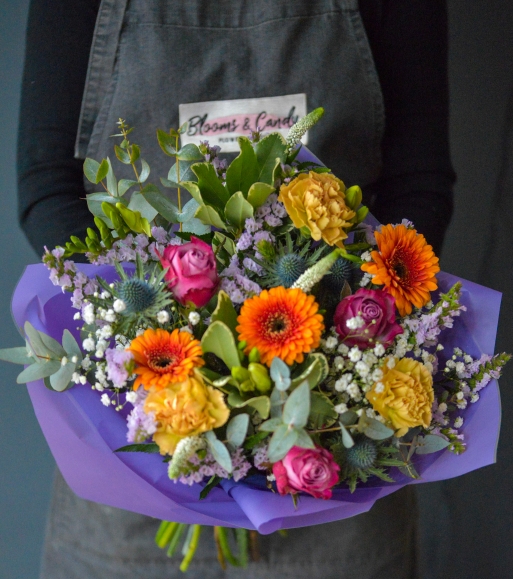 Nice mixture of orange, lilac, white and cream colours and textures. arranged by local florist in Bromley and Beckenham