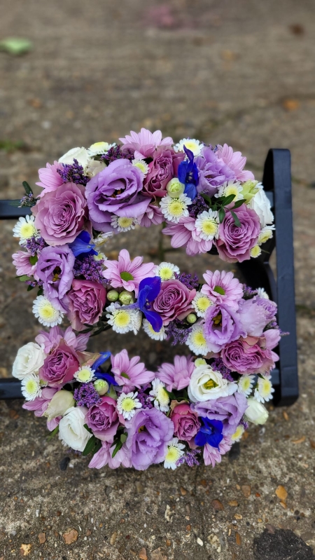 Lilac mixed funeral letters by Blooms and Candy Florist from Hayes, Kent. 