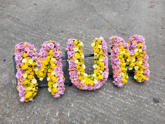 Luxury roses and lisanthius mixed funeral letters made by Blooms and Candy Florist
