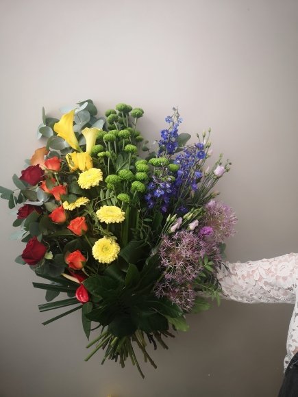 Rainbow funerals flowers arranged by florist in Croydon, Surrey