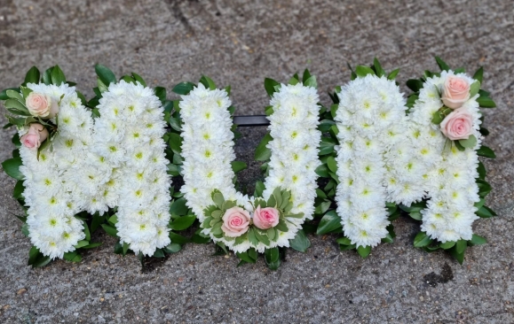 based funeral letters with foliage edging by Blooms and Candy Florist