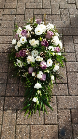white and lilac roses funeral flowers teardrop spray made by florist in Bromley, Kent, UK for flower delivery in BR1 BR2 BR3 BR4 BR5 BR6 BR7 BR8 CR09 CR0 TN16 SE3 SE6 SE9 SE12