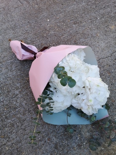 White hydrangeas lifestyle flowers wrap with eucalyptus made by florist near me in Bromley 