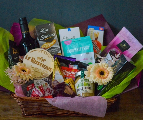 luxury hamper made of finest products to include wine, cheese, snacks, chocolate, olive, jam, dressed with flowers and presenten in large hamper basket. Made by florist in Bromley, Beckenham, West Wickham, Shirley, ony Hall, New Bwckenham, Orpington, Chislehurst, Bromley South, Anery, Penge, Crystal Palace