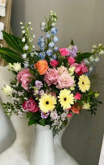 Metal jug with mixed fresh flowers made by florist in Bromley, Kent