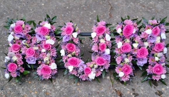 mixed pinks funeral letters from Rowland Brothers and Co Op Funerlcare brochure made by florist in Bromley