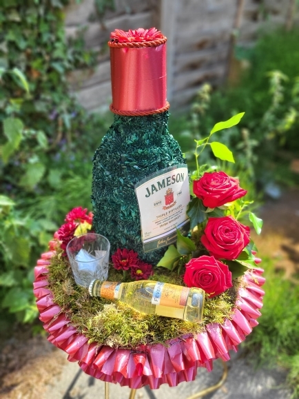 3 d beer bottle funeral flowers by Blooms and Candy florist