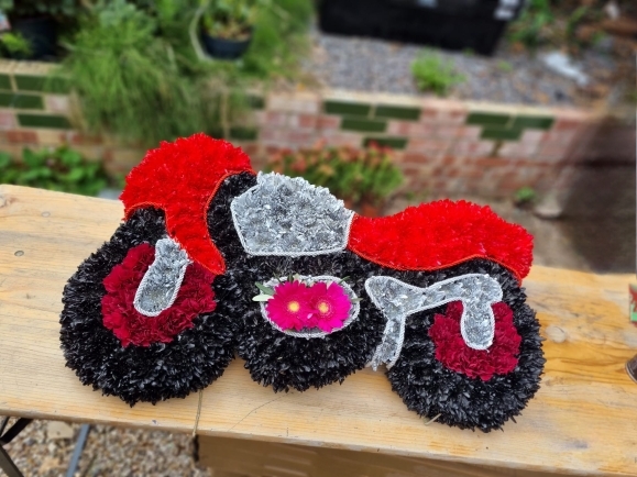 bike funeral flowers by Blooms and Candy