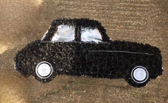 funeral flowers car by Blooms and Candy Florist