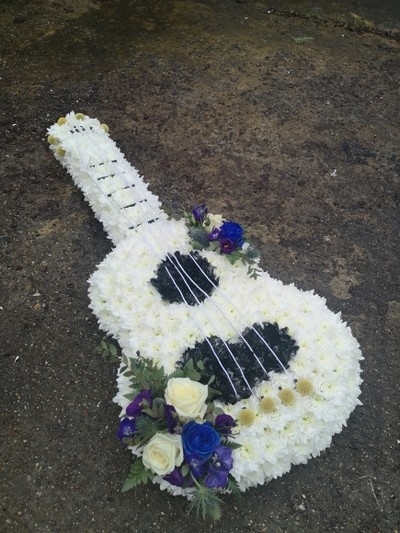 classic guitar funeral flowers by Blooms and Candy Florist