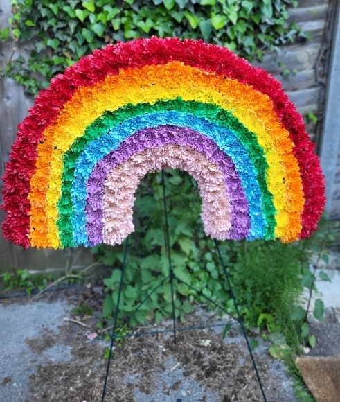 funeral flowers rainbow by Blooms and Candy Florist