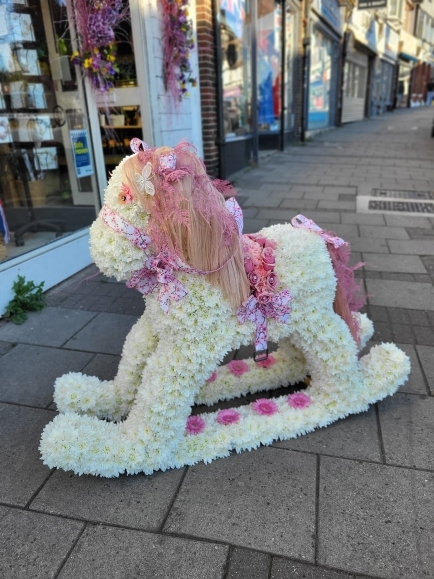 Real size rocking horse based in white chrysanthemums, colours and style can be changed. by Blooms and Candy Florist