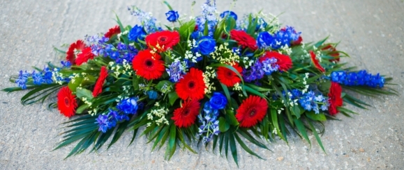 blue and red cofin spray for Crystal Palace fan from Blooms and Candy Florist in Hayes for free delivery in Bromley, Croydon, Croydon Crematorium, Heither Crematorium, Beckenham Crematorium, Lewisham Crematorium