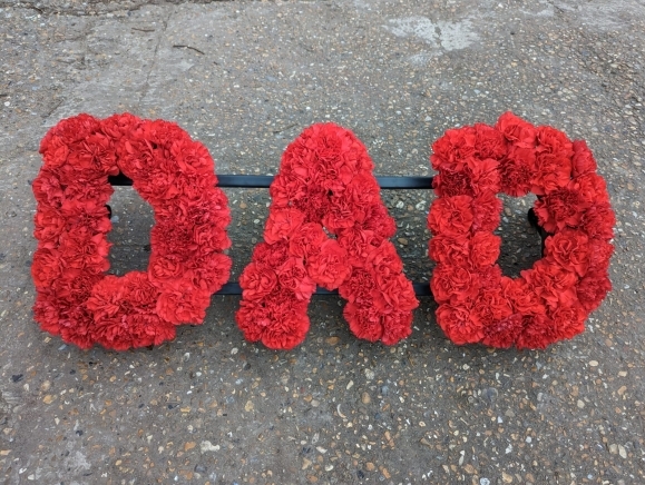 Carnations based funeral lettering by florist in Hayes, Bromley, Kent
