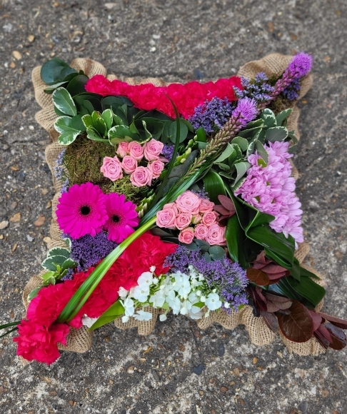 Amazing avant-garde design with tropical flowers and unusual foliage. Colours can be personalised. By florist in Bromley
