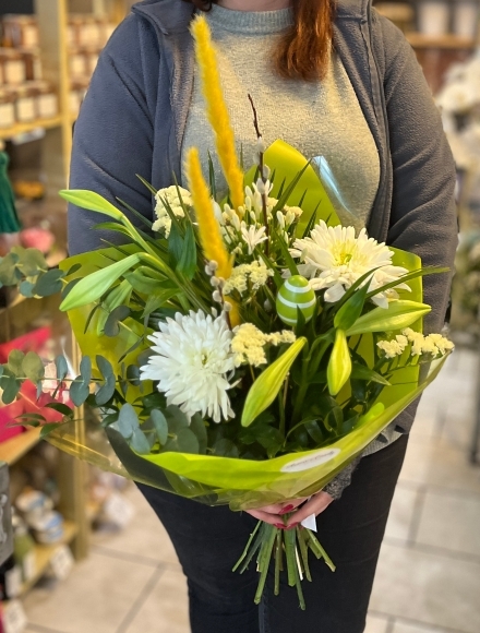 Longi lily, pussy willow, eucalyptus, yellow grass, egg pick, agapanthus, limonium and blooms wrap perfect for a vase. Made by florist in Bromley 