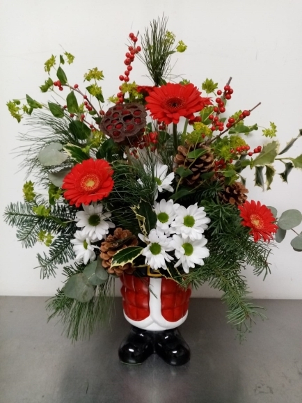 Christmas Santa pot arrangement with fresh flowers