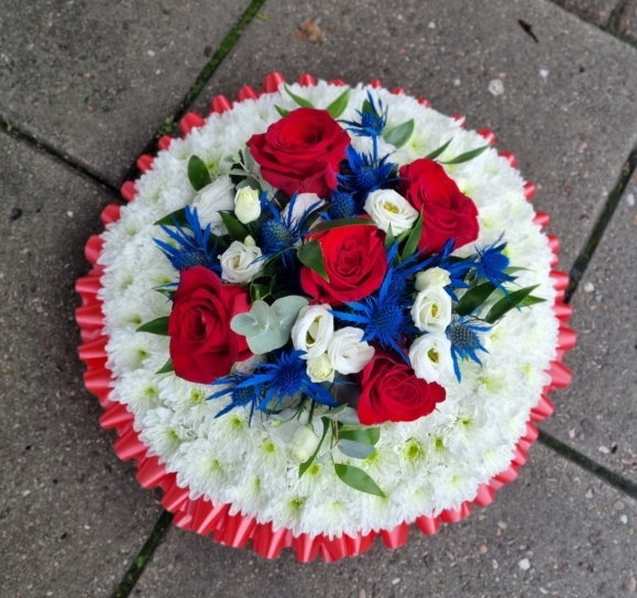 union jack colours funeral posy pad by Blooms and Candy Florist