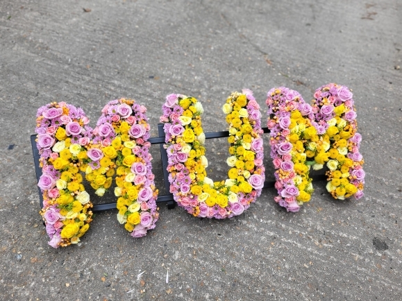 Luxury roses and lisanthius mixed funeral letters made by Blooms and Candy Florist