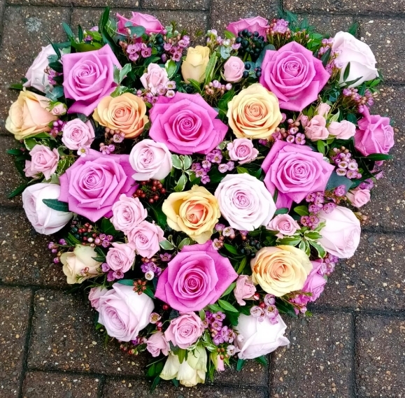 Pastels solid funeral heart made by florist in Bromley, funeral flowers in South London