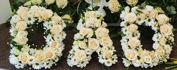 Gorgeous creams and white mixed funeral letters made by funeral florist in Bromley for free delivery in Bromley, Beckenham, Croydon and South London