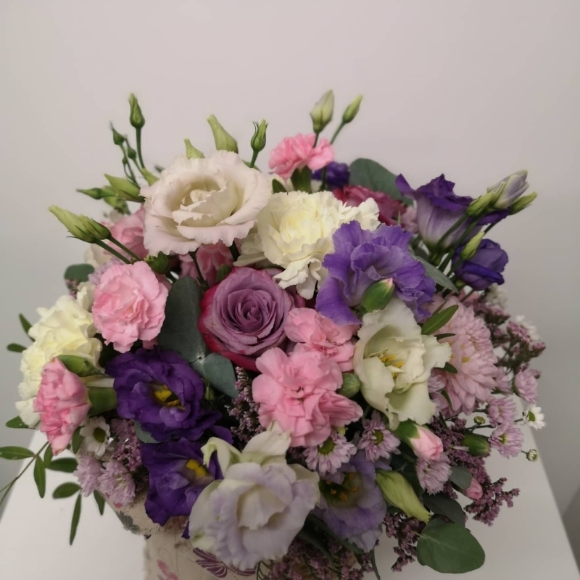 Pastel flowers round basket posy arrangement to include roses, lisanthius, seasonal flowers perfect for Mother's Day
