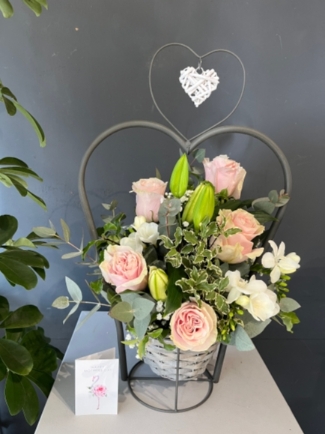 Stunning scented design with roses, freesias and lily arranged in wicker metal heart pot which can be reused as a porch planter. Perfect gift for Mother’s Day by florist in Hayes, Bromley, Kent