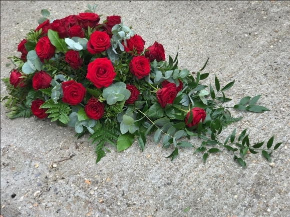 Big heads roses in funeral spray in the shape of tear made by florist near me in Bromley, Kent