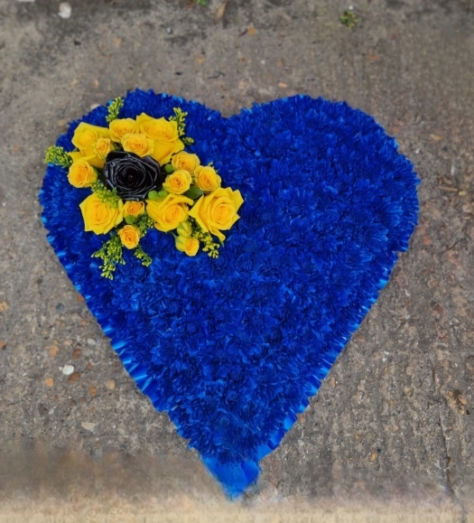 Sprayed funeral heart by Blooms and Candy Florist from Hayes