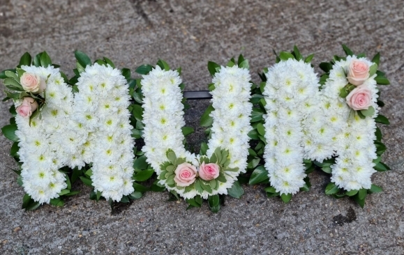 based funeral letters with foliage edging by Blooms and Candy Florist